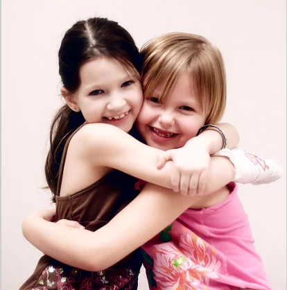 2 girls hugging.webp