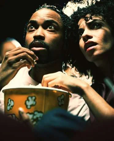 200176576-005-man-and-woman-in-theater-eating-popcorn-gettyimages.webp