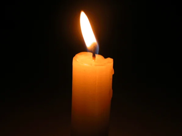 candle with flickering flame.webp