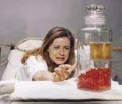 crying reaching for pills.webp