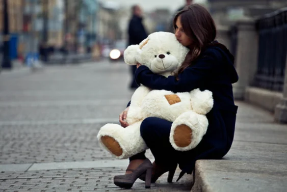girl hugging teddy bear for when I can\'t verbalize how I feel.webp