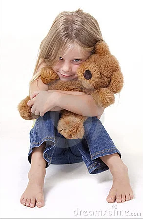 little girl hugging teddy bear.webp