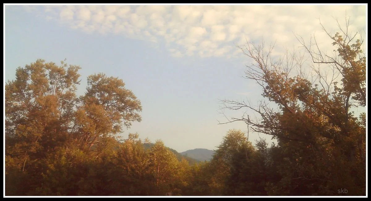 Neat clouds above mountains.webp