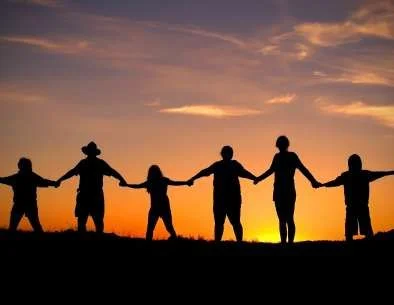 people-holding-hands-sunset.webp