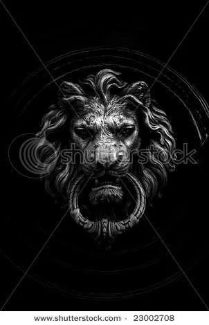 stock-photo-black-and-white-shot-of-a-classic-door-knocker-in-the-shape-of-a-lion-23002708.webp