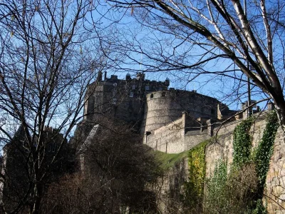 Edinburgh Castle through the trees.webp