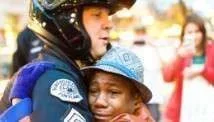 141129122705-portland-ferguson-protest-hug-left-tease.webp