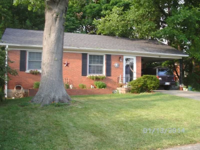 Front yard with me in doorway.webp