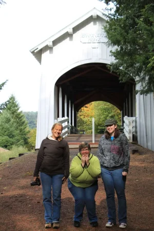 Goofy Karen in front of covered bridge.webp